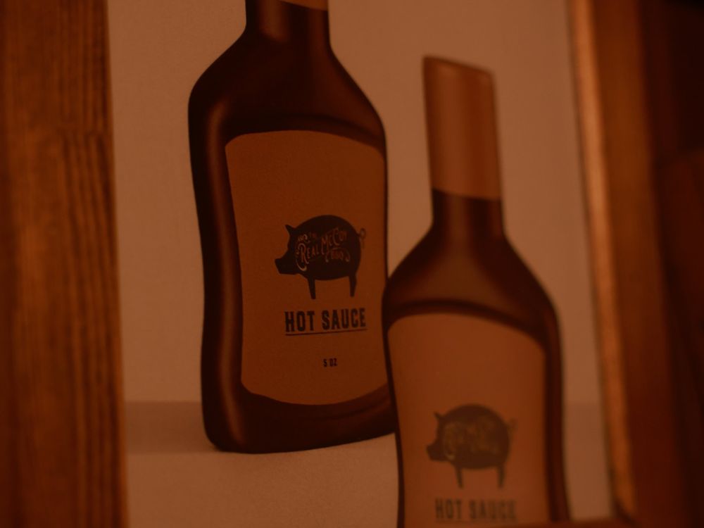 The Real McCoy's hot sauce branding inside the Blood Money escape room