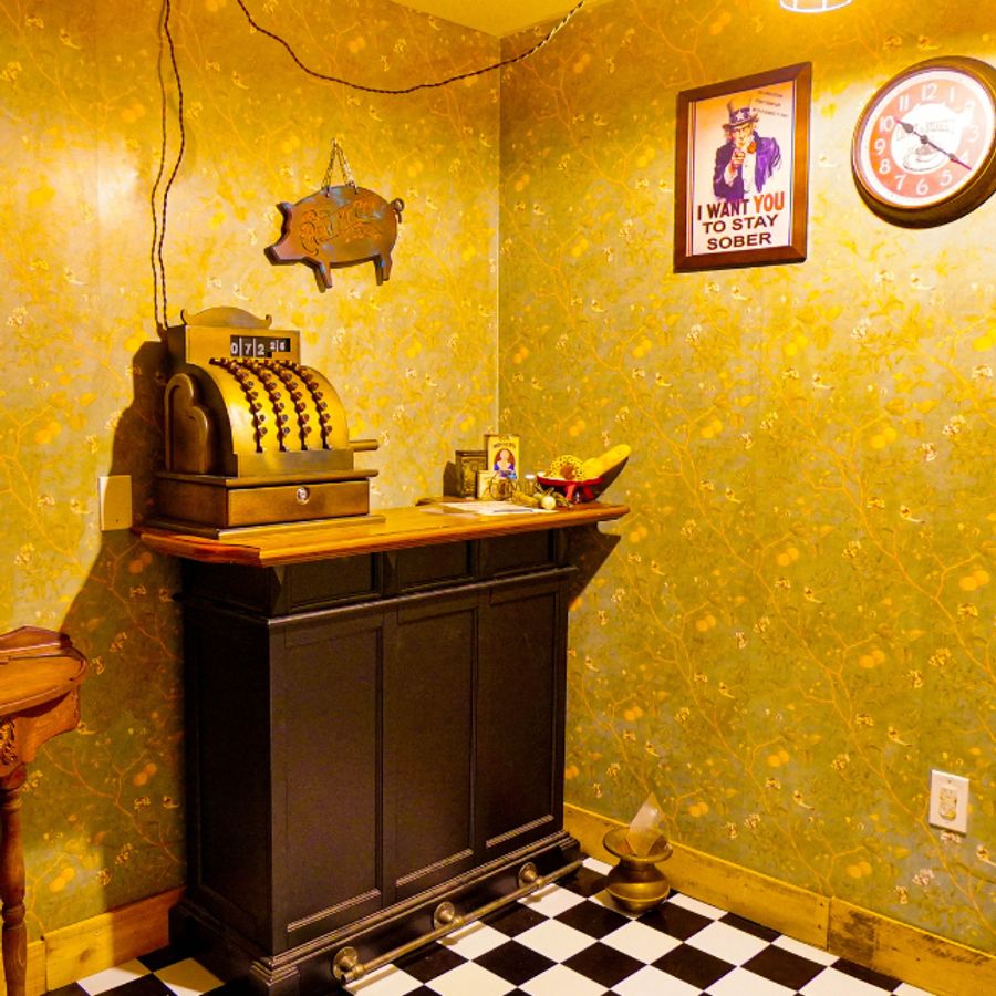 A vintage cash register inside the Blood Money escape room